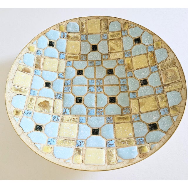 A colorful blue and yellow geometric design ceramic tile bowl. tiles are hand laid into a metal gold anodized aluminum...