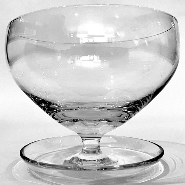 Simply beautiful set of six mid-century modern crystal dessert coupes. Each features a unique cupped footed base beneath a...