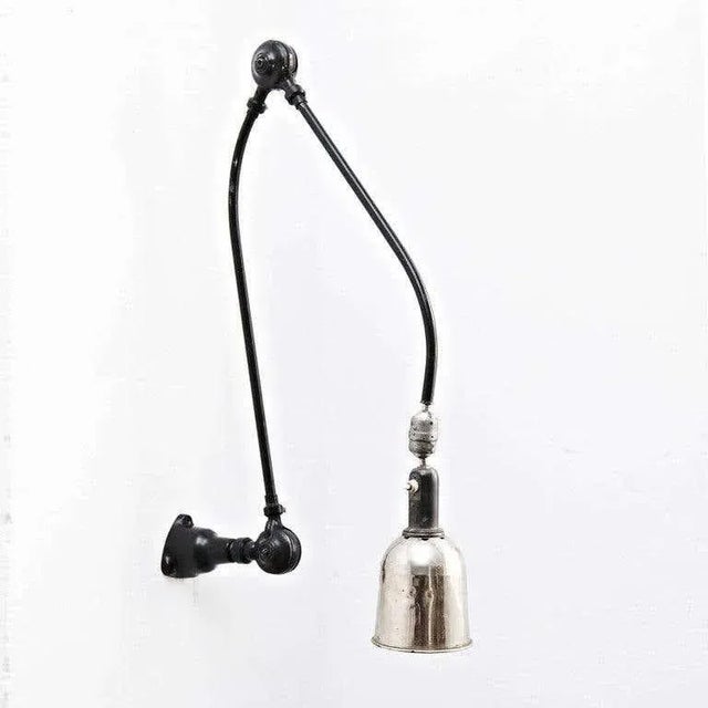 Wall lamp designed by Johan Petter Johansson. Manufactured by Triplex (Sweden), circa 1930. Aluminium and steel. This...