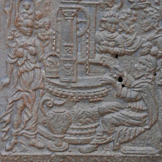 DETAILS An antique cast iron stone plate panel featuring a religious biblical scene of Rebecca at the Well in relief. This...