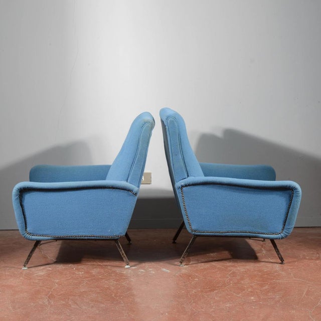 Pair of 1960s armchairs with blue metal and fabric base. The metal structure and the fabric covering show signs of aging,...