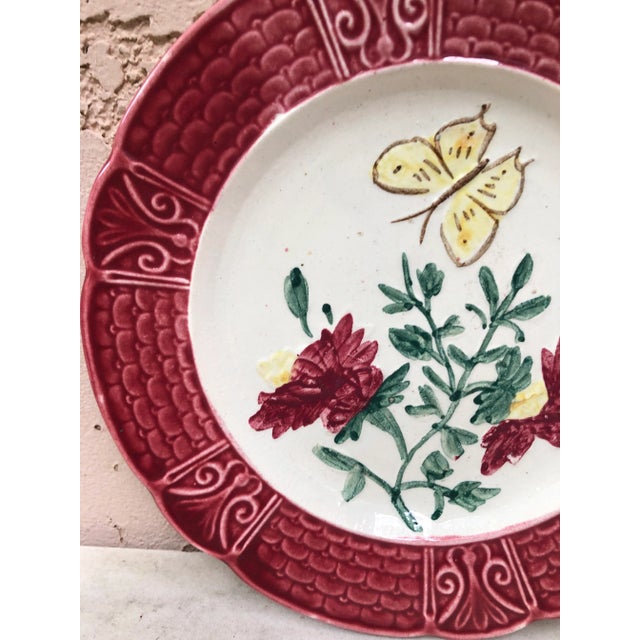 French Majolica plate with a butterfly and flowers circa 1900.