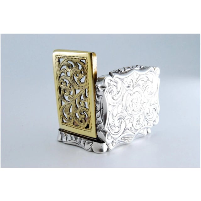 Victorian Silver and Gold Vinaigrette Box with Engravings, in Very Good conditions. Designed before 1890 This piece has an...