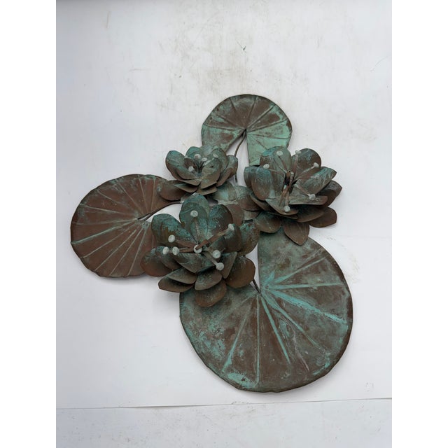 A lovely set of artisan copper leafs. The leafs are styled as lilly pads and feature unique details and design. They would...