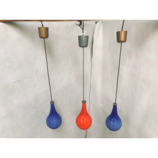 Set of 3 double-layered glass ceiling lights, blue and red, 70s. Lamps made of double-layered glass, white inside, blue...