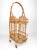 Small bamboo bar cart, two levels, with originals wheels and an elegant braided handle. Made in Franche in the 1960s.