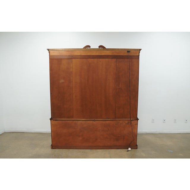 This vintage Hickory Chair Company china cabinet is a beautifully executed example of traditional American craftsmanship,...