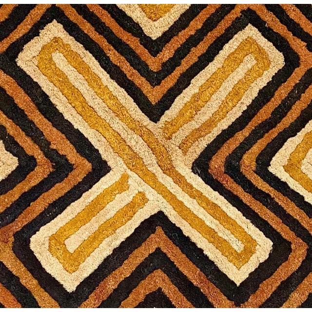 Traditional vintage Kuba grass textile handmade from the indigenous people of the Congo. Bold geometric patterns created...