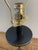 From Ralph Lauren Home comes this elegant table lamp in like new condition. A clear glass cyclinder fitted over a black...