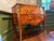 A beautifully inlaid Louis XV ormolu-mounted commode in kingwood and tulipwood marquetry with a molded breccia marble top....