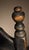 New England banister back chair, Circa 1710-50, is in wonderful crazed old black paint with gilt pinstriping to accentuate...