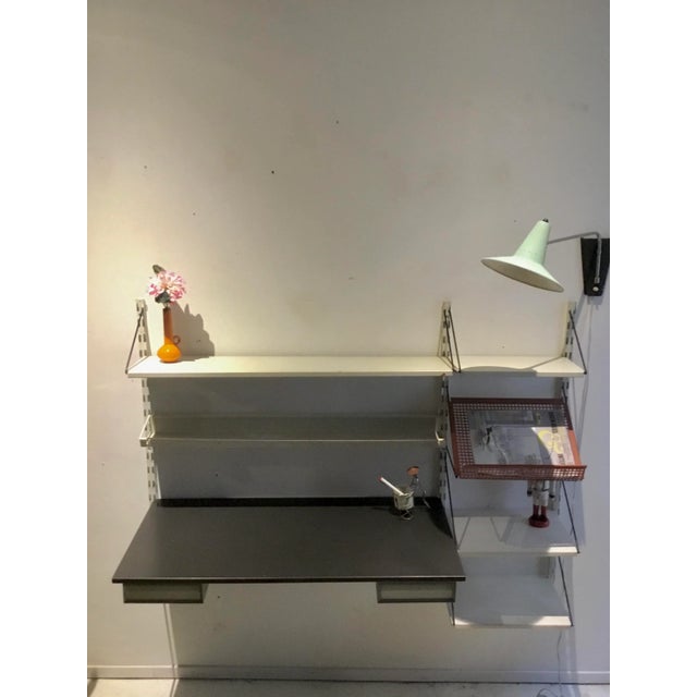 Dutch Wall Unit by Tjerk Reijenga for Pilastro, 1955, in Good conditions. Designed 1950 to 1959 This piece has an...