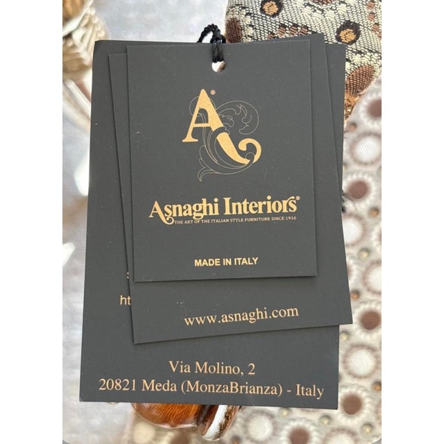 Set of two armchairs and one round side table by Asnaghi Interiors, crafted in a Baroque Rococo style. The armchairs...