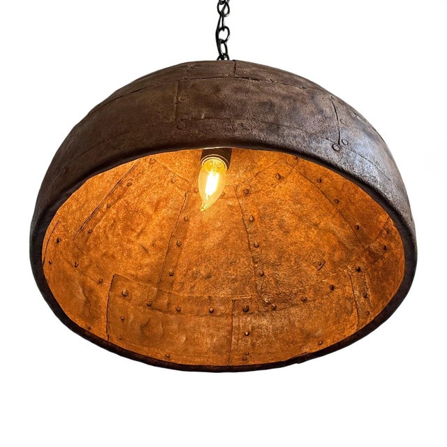 Vintage iron pendant light crafted from a hand-forged bowl from early–mid 20th century India. Such vessels were...