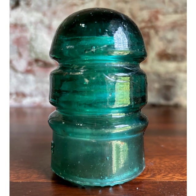 This is an antique Brookfield Glass Company CD 145 “beehive” telegraph and telephone-line insulator, dating approximately...
