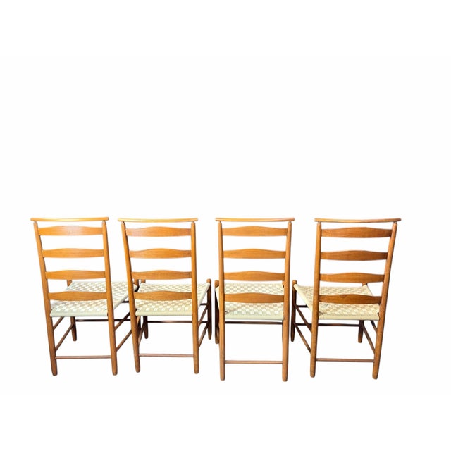 For sale is a lovely set of four vintage chairs made from solid cherry wood, designed in the shaker style