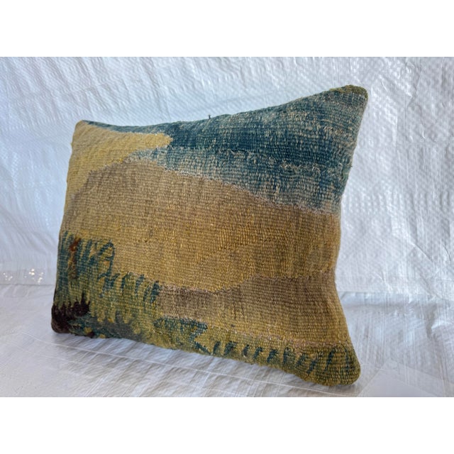 This decorative pillow is made from an authentic 17th century Flemish tapestry fragment, transformed into a refined yet...