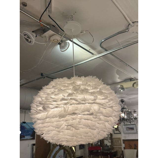 Design Plus Gallery presents the Eos Feather Pendant from Umage. This pendant has a voluminous white shade made with all-...
