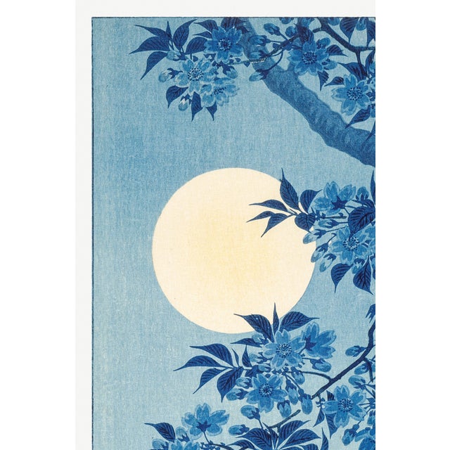 Vintage Japanese artwork depicting blossoming cherry branches illuminated by a full moon, originally designed by Ohara...