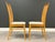 A set of four mid century modern style solid beech dining chairs with off white seats. Made in Italy. Great overall...