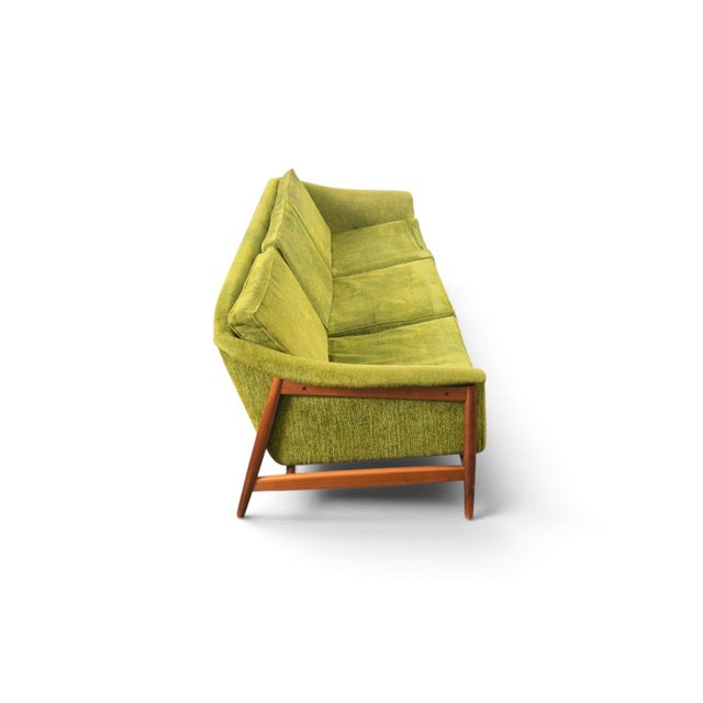 Origin: Sweden Designer: Folke Olhsson Manufacturer: DUX Era: 1960s Materials: Walnut, Wool Measurements: 86″ wide x 30″...
