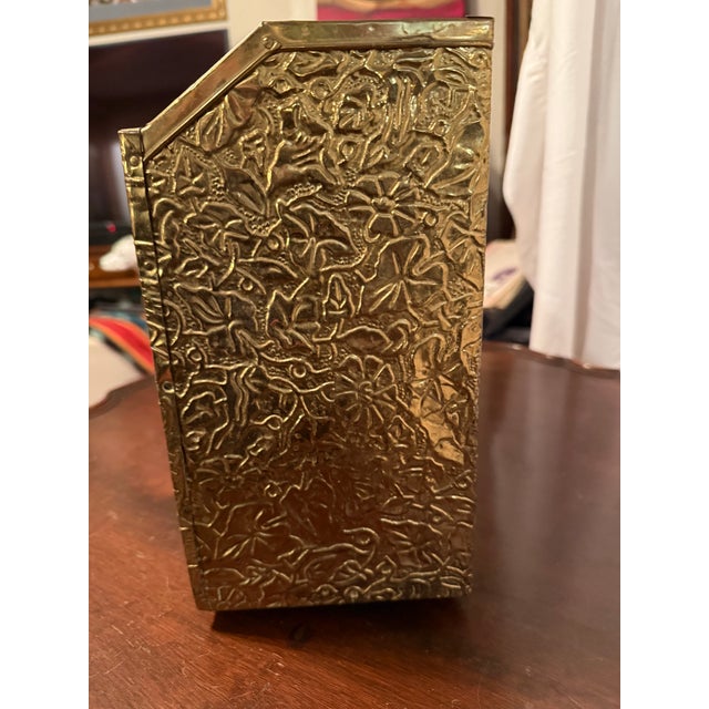 Beautifully brass repoussé magazine Rack. Made in England, solid wood, clad in heavy hammered brass. Intended for...