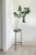A gorgeous and rare vintage monumental blown glass vase on a wrought iron pedestal stand. In a rustic aged patina given...