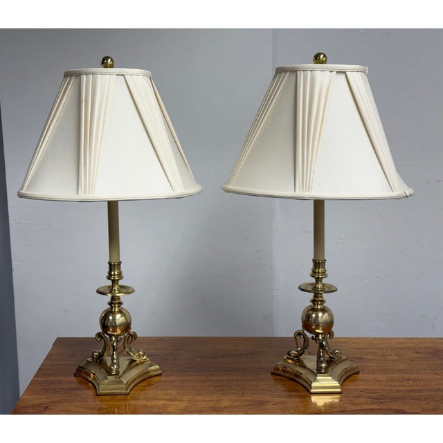Design Plus Gallery presents a pair of Vintage Neoclassical Brass Dolphin Table Lamps by Frederick Cooper. This matching...
