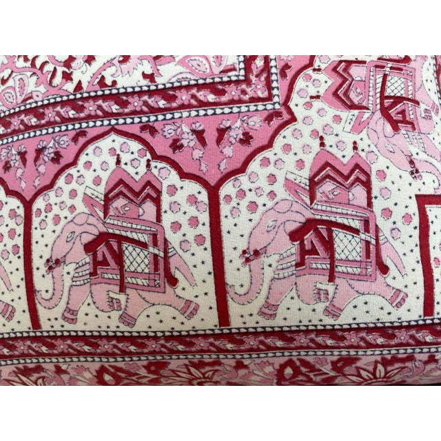This vintage pillow showcases a style inspired by traditional Indian textiles, featuring intricate floral and elephant...