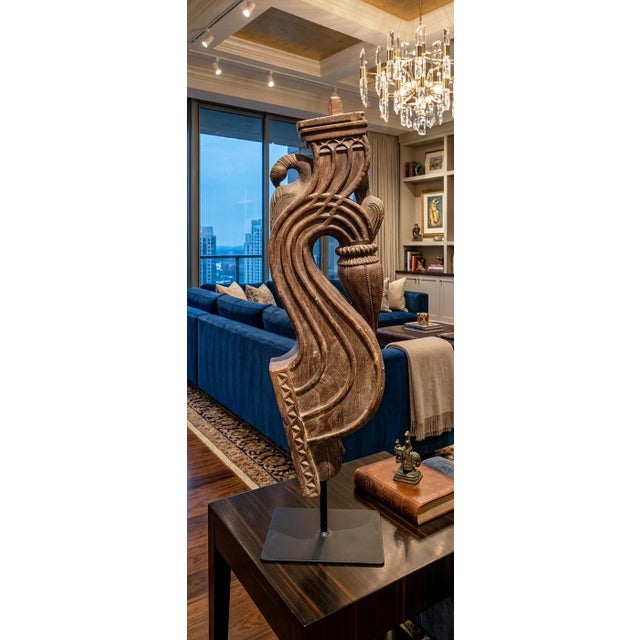 An extraordinary example of traditional Indian architectural craftsmanship, this monumental 46-inch hand-carved wooden...