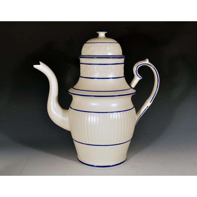 Castleford-Type White Stoneware Coffeepot, Blue Lined, English Regency England, circa 1820 A tall, architectural white...