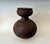 Nigerian Water Vessel Nupe Peope Nigeria, mid 20th Century The double-tiered design of this vessel expresses both the...