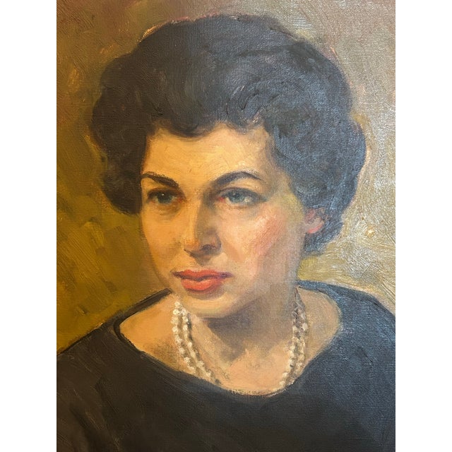 Standout oil painting on canvas of a woman with flowers sitting for her portrait. Signed HC Walcott, and presented in a...