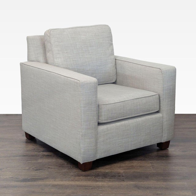 This West Elm lounge armchair features clean lines and a modern linen fabric for a sleek look. The wide, cushioned seat...