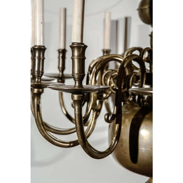 This antique 12 light chandelier is thought to be Dutch, from the earlier part of the 19th Century. It has been French...