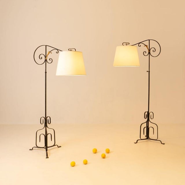 RENÉ DROUET (1925-2017) Pair of adjustable floor lamps, France, circa 1940. Painted wrought iron, new fabric lampshades...