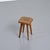 Stool made of solid oak in France in the 1950s. Its square seat with gently softened corners rests on four tapered,...