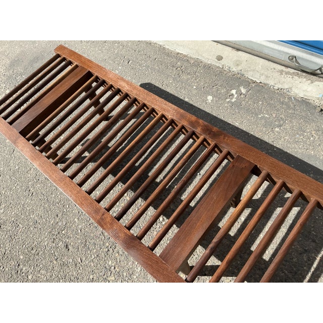 Mid century solid walnut bench in manner of Milo Baughman for Glenn of California. The bench is in excellent condition....