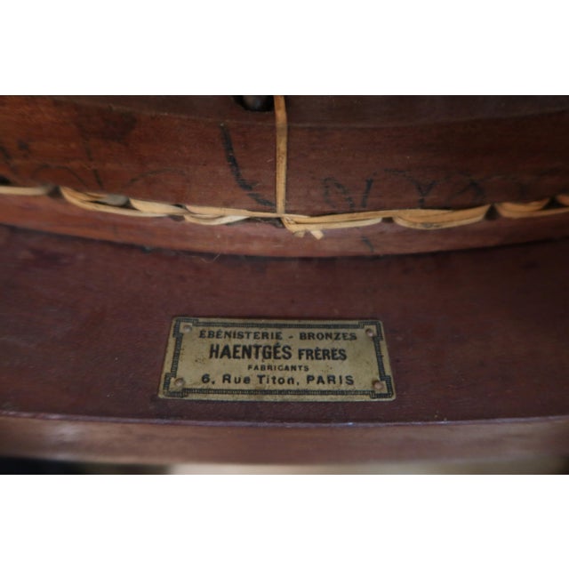 Louis XVI style walnut cane armchair by Haentges. Very good condition. DIMENSIONS: 0.88m high, 0.49m deep, and 0.59m wide....