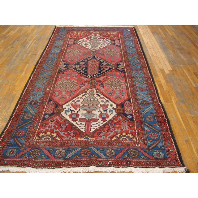 Antique Persian Bakhtiari rug, measures: 5' 3" x 10' 4". Antique Bakhtiari Hallway Runner Wool Coral Rug, Country of...