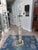 A graceful vintage floor lamp inspired by the elegant floral lighting designs associated with Frederik Raymond. This...