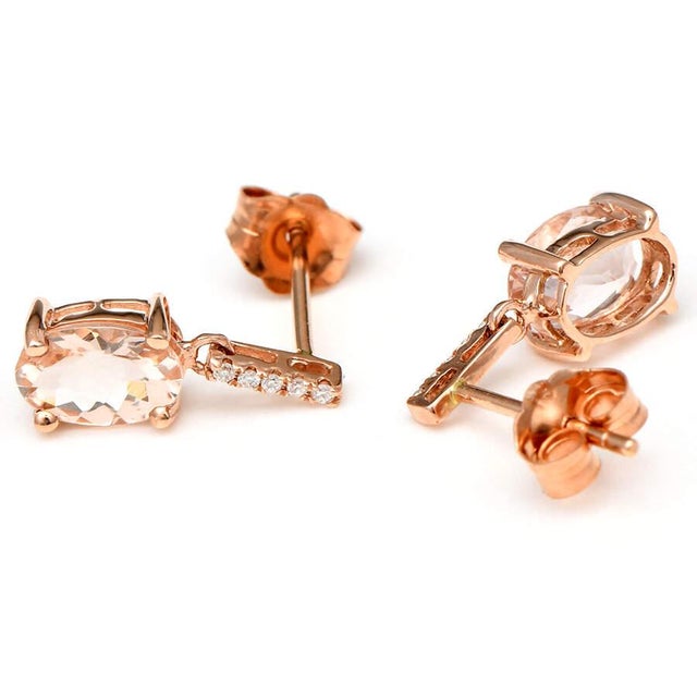 The rich and warm color of morganite and diamonds encased in 14-karat rose gold adds to the beauty of these drop earrings,...