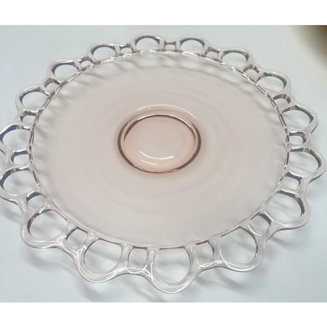 This lovely, nearly 100 years old pale pink "Depression Glass" cake/serving platter is absolutely precious. The...