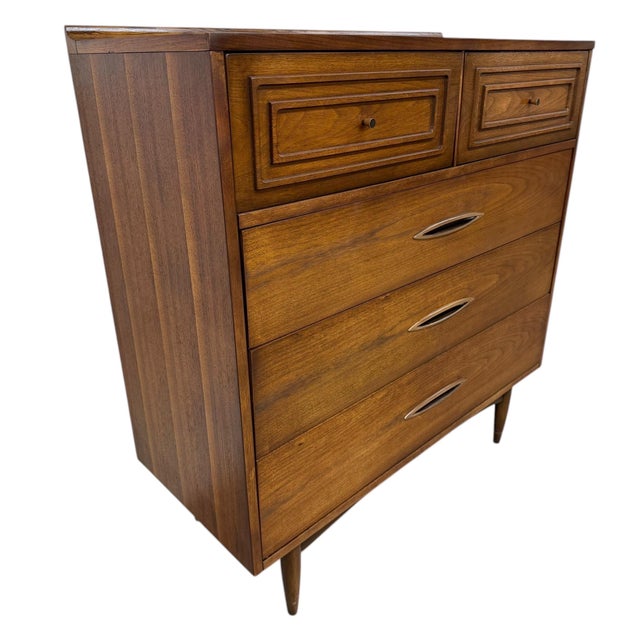 Elevate your space with this authentic 1960’s Mid-Century Modern Broyhill Sculptra walnut high chest, freshly refinished...