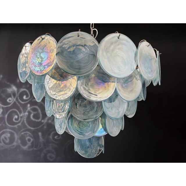 Italian murano chandelier. The chandelier has 57 murano blue albaster iridescent glass disks. The glasses are now...