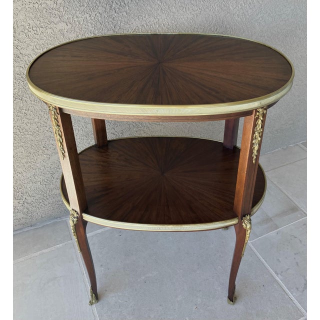 French Circa 1930 Louis XVI-Style Mahogany Starburst Marquetry Two-Tier Oval Accent Table With Brass Mounts For Sale - Image 3 of 18