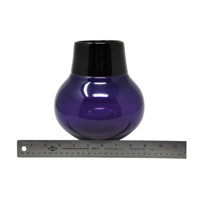 A gorgeous and sophisticated hand-blown glass vase by glass artist Steven Correia. Made with purple and black glass, the...