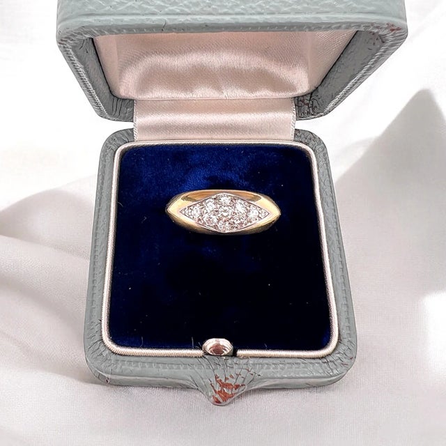 Bangle ring from the 50s-70s by jeweler OJ Perrin. This ring is made of 18 carat gold (750 thousandths) and platinum and...