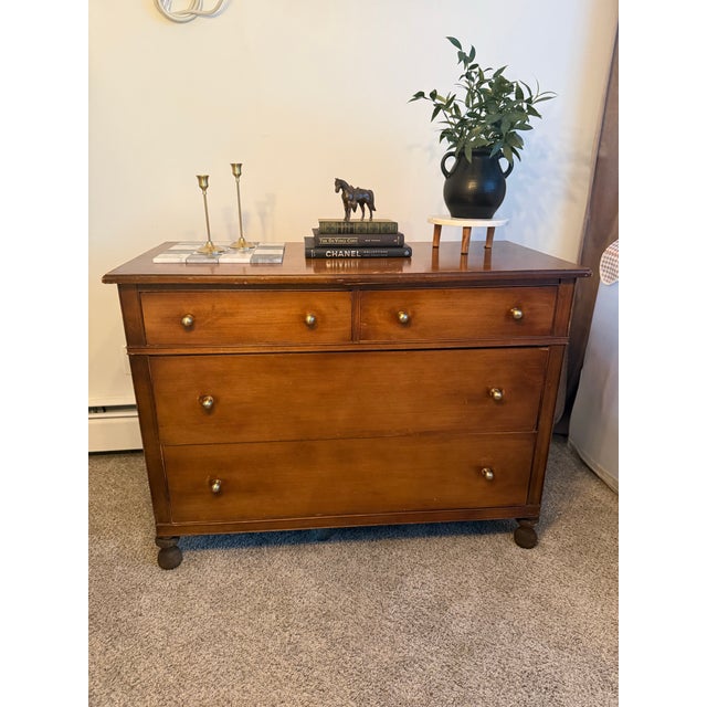 This early 20th-century chest of drawers was produced by the Davies-Putnam Company of Grand Rapids, Michigan and retains...