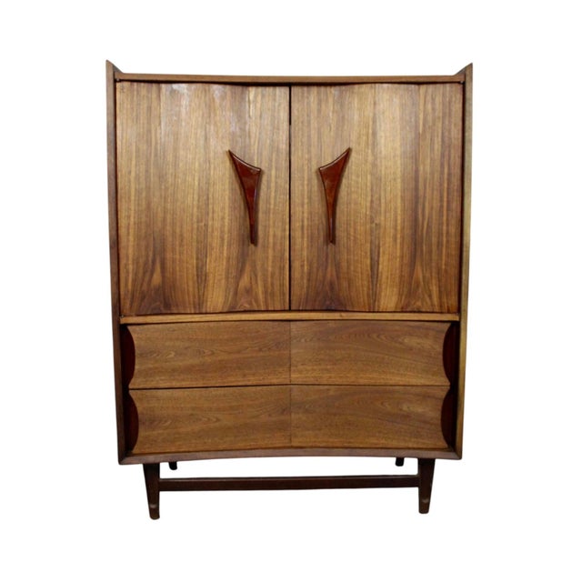 This is a stunning walnut highboy by Specialty Woodcraft. Sporting two contoured doors and sculpted drawers, this piece...